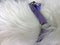 Close up of violet dog leash on white silky white long fur texture. Full frame of white seamless cotton, texture of fluffy fur for