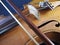 Close-up of a violin, a wooden string instrument, and a bow.