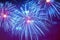 Close-up of vivid blue fireworks with sparks. Explosive pyrotechnic devices for aesthetic and entertainment purposes