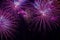 Close-up of vivid purple fireworks with sparks. Explosive pyrotechnic devices for aesthetic and entertainment purposes