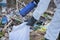 Close up Volunteer man in white protective clothing collects garbage