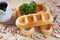 Close-up waffles with nut on wood plate