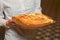 Close up of waiter serving a plate of Khachapuri - hachapuri in Adjarian. Waiter at work. Restaurant service.