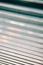 Close up wallpaper of a blind with cinematic tones during a sunny day
