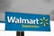 A close up of a Walmart sign. A multinational retail corporation that operates a chain of