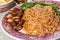 Close-up of wanton noodle with barbecue pork, vegetable and dumpling, popular Chinese food