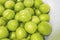 Close up washed green plums in water