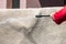 Close up of washing carpets with high pressure washer. Cleaning the carpet with a gun for washing high pressure water. House