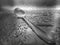 Close-up of water drops on the sink with a metal spoon.