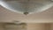 Close up of water leakage dropping through a ceiling lamp at home - problem of water leaking in a house