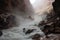 close-up of water rushing through canyon, with mist rising from the stream