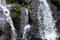 Close up of waterfall. Dynamic water flow. Waterscape background. Nature and environment concept. Pucak Manik waterfall Bali,