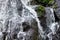 Close up of waterfall. Dynamic water flow. Waterscape background. Nature and environment concept. Pucak Manik waterfall Bali,