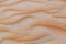 Close up of wave sand dunes pattern. Desert sand background or texture