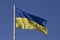 Close up of waved Ukrainian flag on flagpole