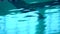 Close up of waves over deep water in swimming pool.
