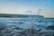 A close up of the waves splashing against the Swanage, Dorset seaside town rocks