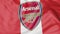 Close-up of waving flag with Arsenal F.C. football club logo