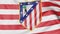 Close-up of waving flag with Atletico Madrid football club logo