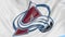 Close-up of waving flag with Colorado Avalanche NHL hockey team logo, seamless loop, blue background. Editorial