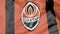 Close-up of waving flag with FC Shakhtar Donetsk football club logo