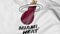 Close-up of waving flag with Miami Heat NBA basketball team logo, 3D rendering