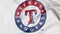 Close-up of waving flag with Texas Rangers MLB baseball team logo, 3D rendering