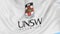 Close-up of waving flag with University of New South Wales emblem, seamless loop, blue background. Editorial animation