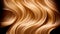 Close-up of wavy golden hair strands , beauty and fashion concept. Macro shot of female blond hair strands, top view. Hair care