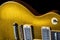 Close up of Wear on a Vintage Gold Electric Guitar Showing Age