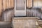 Close up of Weathered Wood Siding Beginning to Rot Around Front Step of Cottage or House