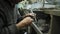 Close-up of weaving a silver bracelet, the hands of a master jeweler make a new product, selective focus