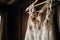close up of wedding dress details hanging on an antique wooden hanger