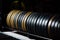 Close-up Weight plates rack in the gym. Many barbell discs in yellow, black, green. multicolor.