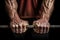 close-up of a weightlifters hands gripping a barbell