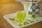 Close up Welcome Green tea with tea pot on the wooden table