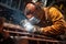 close-up of a welder at work on a ships hull