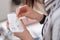 Close up of well-attended hands keeping orange tablet