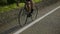 Close up of wheels of bicycle spinning while caucasian sportsman riding vehicle