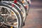 Close up Wheels of Parked bicycles in city