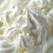 A close up of whipped cream on a plate with some white stuff, AI