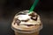 Close up of whipped cream on top of a Java Chip Frappe.