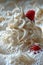 A close up of a whipped cream topping with raspberries on top, AI