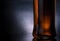 Close-up of whiskey bottle on black background, cool atmosphere