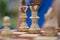 Close up of white chess pieces with focus on King and queen and knight blurred out in background. Concept - idea, strategy