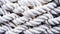 Close-up of a white cotton rope made of multiple strands of yarn twisted together