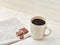 Close-up white cup of coffee with chocolate on white background, top view