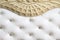 Close-up white fabric upholstered headboard with buttons textile background, retro Stylish bedroom furniture