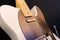 Close up of a white Fender Telecaster electric guitar
