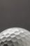 Close up of white golf ball with copy space on grey background